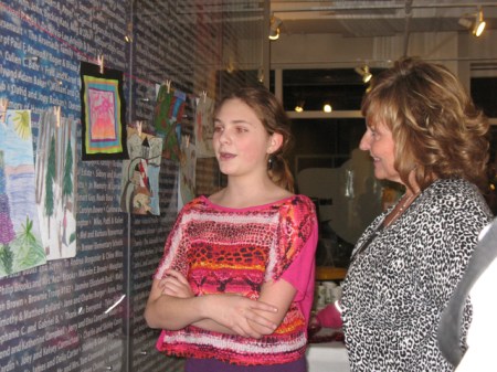 Grade 7 student from RSU78, Rangeley Eva Jacot-Descombes chats with First Lady Ann Lepage about her skiing her favorite trail (in the drawing) at Saddleback