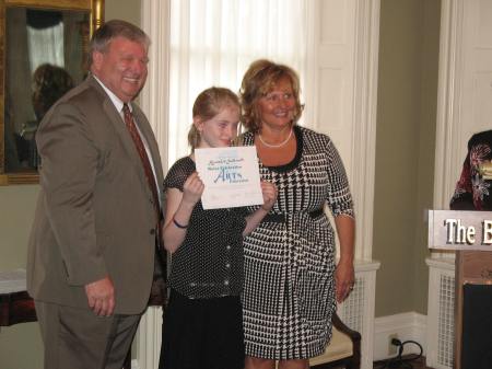 Camden-Rockport Elementary School student Alexandra Southworth, grade 3 with Steven Pound and the First Lady