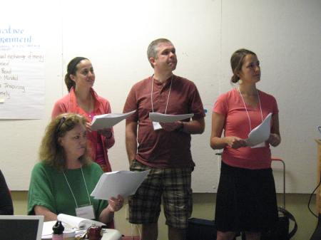 Sitting leadership team member Catherine Ring, (standing) music educators Jen Nash and Bill Buzza, and art educator Shannon Westphal