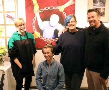 Exhibiting Cony students with art teacher Jason Morgan in front of their painting, “Breaking the Chain” now on show at Harlow’s, “Transforming Violence II”Danforth Gallery