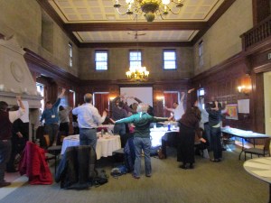 Teaching Artist John Morris leads the MALI teacher leaders in some stretching