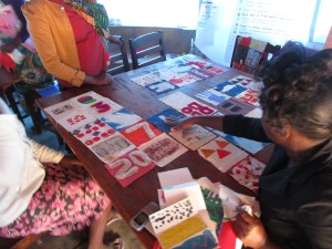 Laying out the quilts, getting ready to sew on the treadle machine.