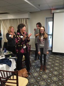 Karin being recognized by the conference participants after viewing her video. Photo by Jonathan Graffius